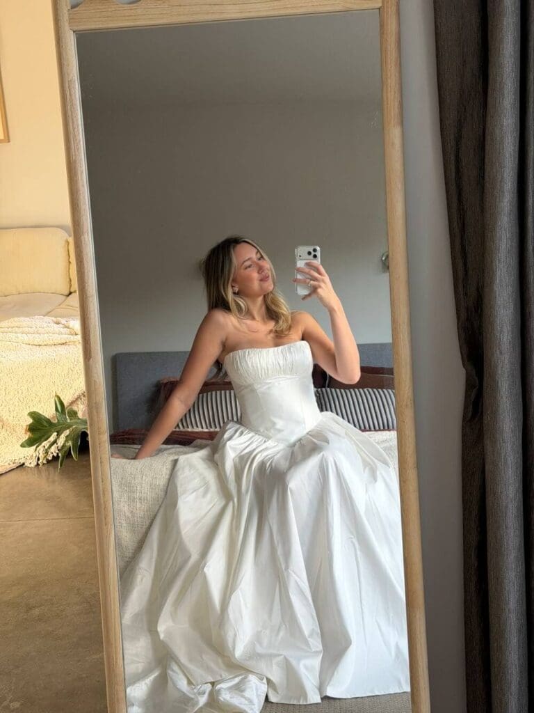 Real bride trying on the Davis Gown at home by Gown & Altar