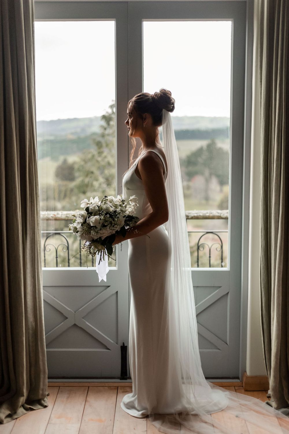 Lovely bridal veil styled with wedding gown