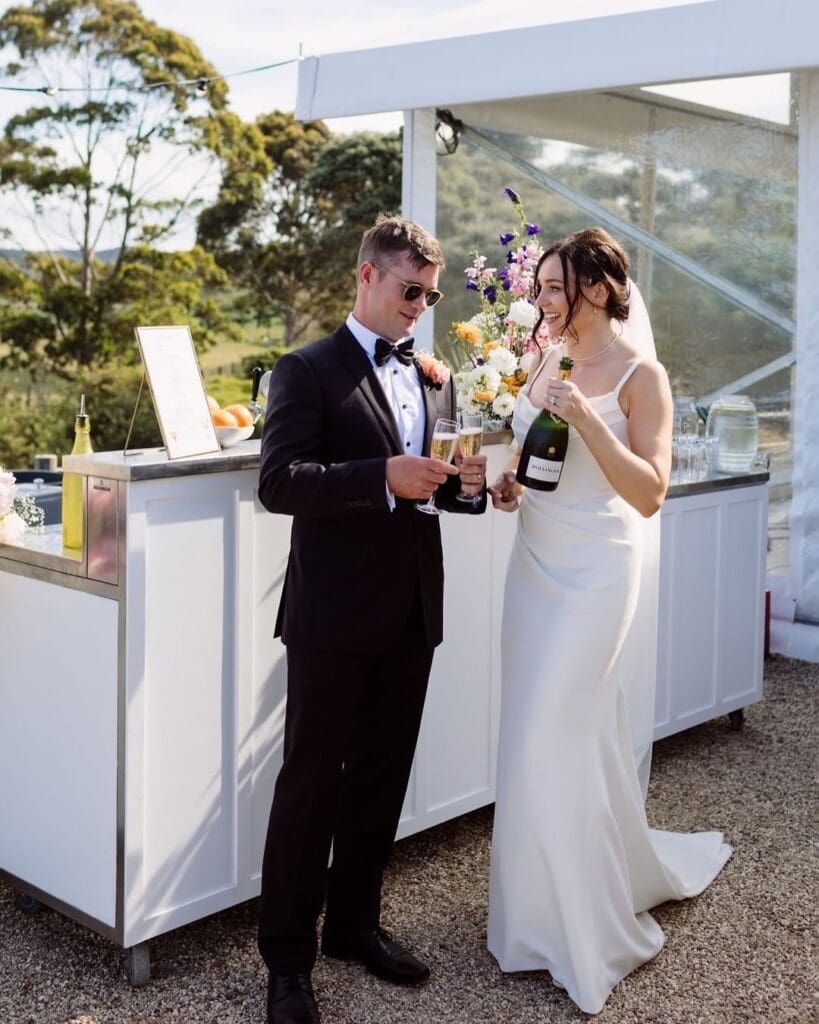 Bianca wearing the Riviera fit-and-flare wedding dress in crepe