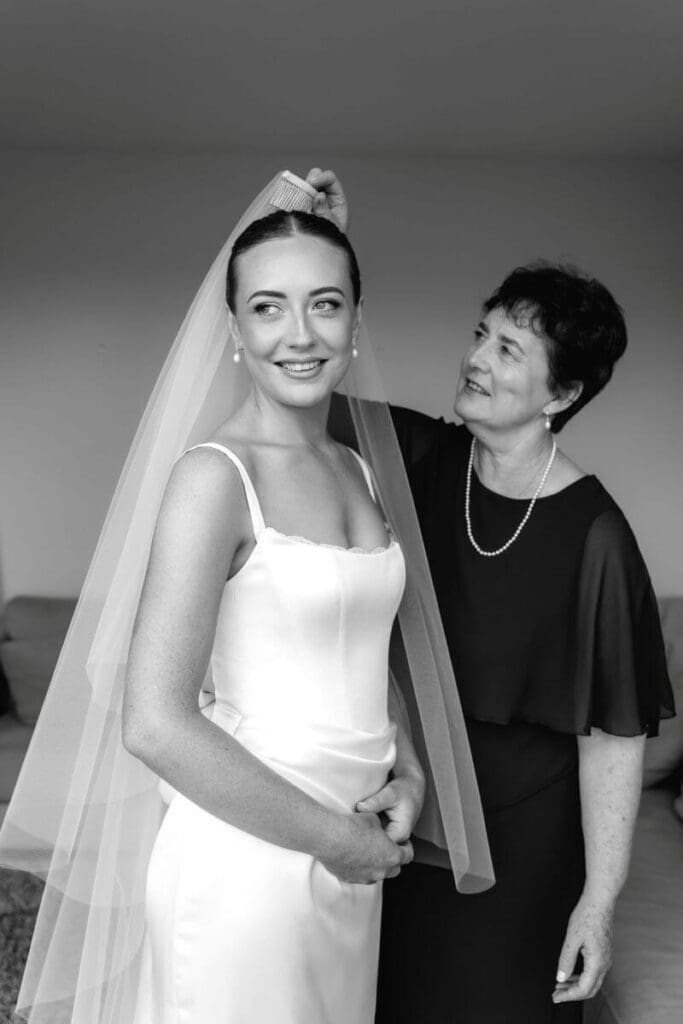 Real bride Sarah wearing a custom Riviera wedding dress with a Minimal Veil