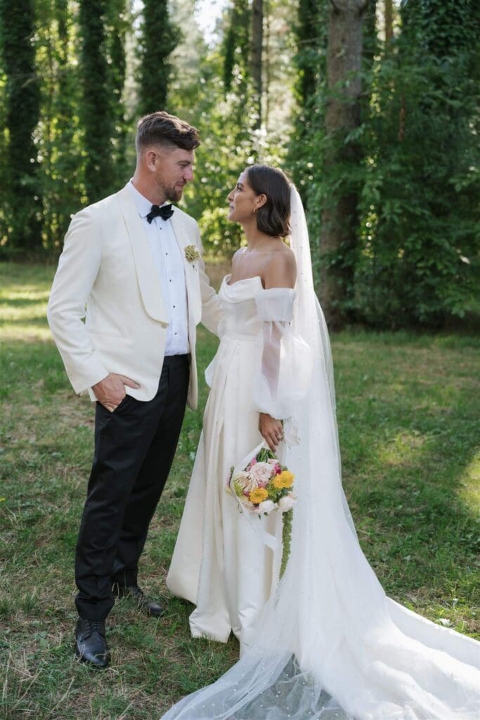 Real bride Kezia wearing a pearl wedding veil with her custom Milan Mini and Pearl Skirt