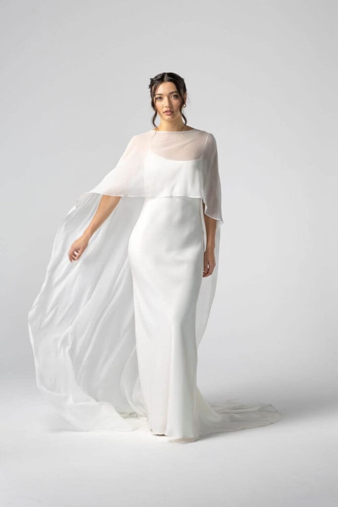Cove silk slip wedding dress styled with a bridal cape