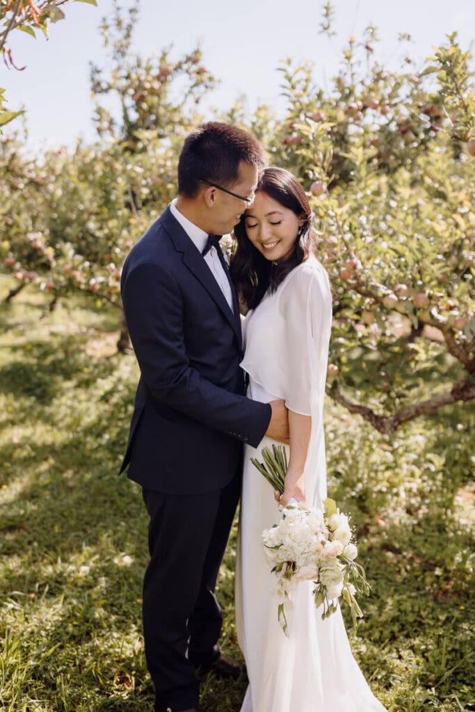 Bride wearing sheer silk bridal cape