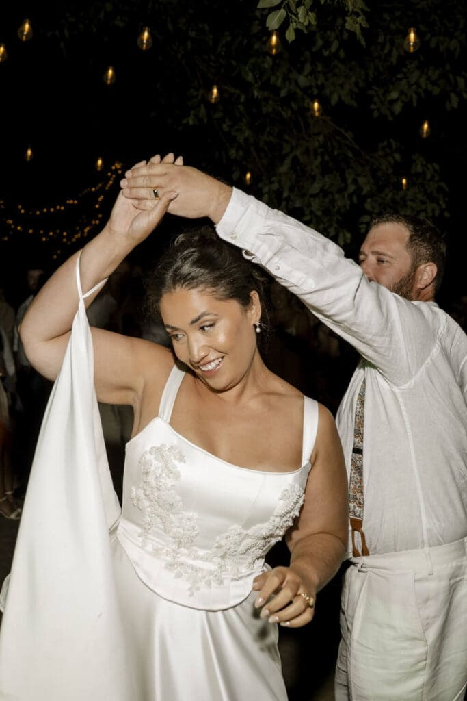 Amaya dancing in the Daphne two-piece wedding dress