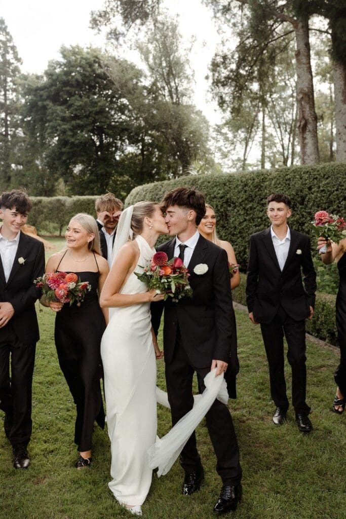 Real bride wearing the Anderson Gown at a garden wedding