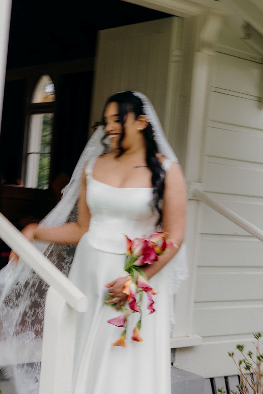 Bride wearing ivory mantilla lace wedding veil